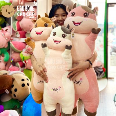 Gấu Bông Bò Sữa Happy gối ôm dài đứng giơ tay