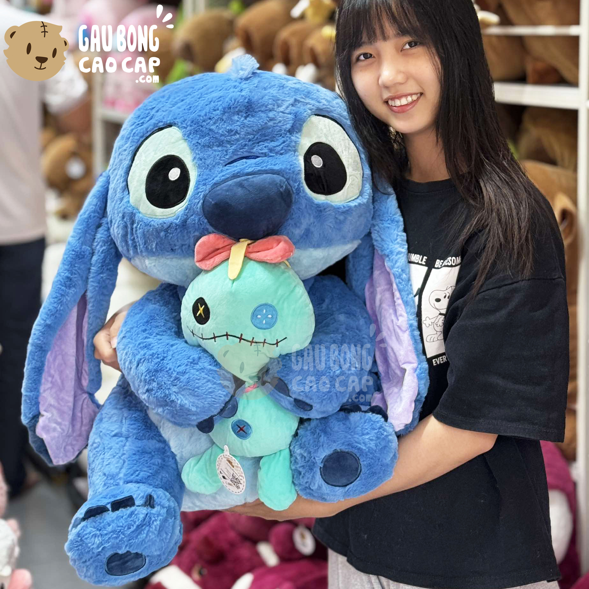 Gấu Bông Stitch Xanh ngồi ôm Búp bê