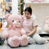 Gấu Bông Teddy Hồng Lông Xoắn Ngực Tim Đeo Nơ